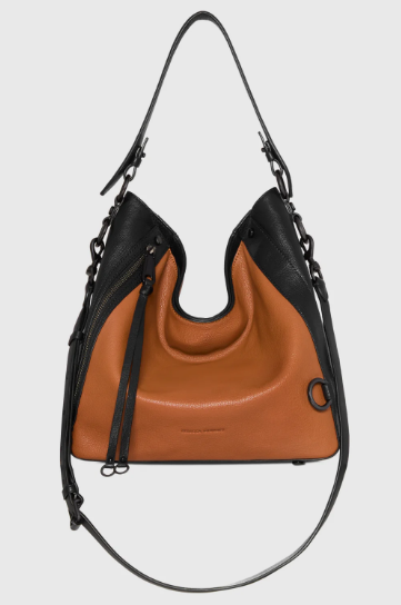 Spacious leather hobo crossbody bag with adjustable strap for casual weekend outings.